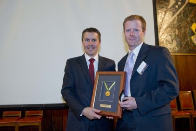 Mark Butler, Minister for Mental Health and Ageing presents Professor Jamie Rossjohn with an Australia Fellowship.