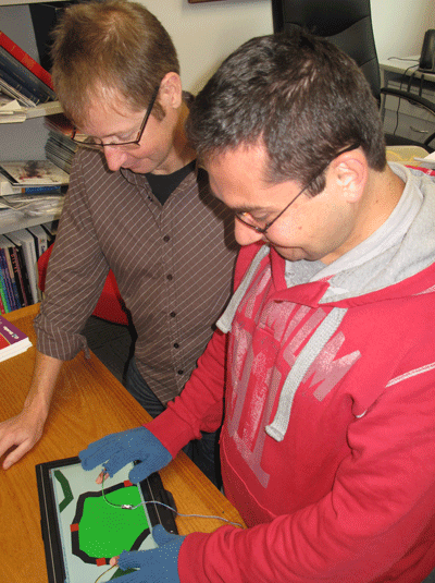 Dr Marriot and Mr Goncu testing out a prototype of the GraVVITAS